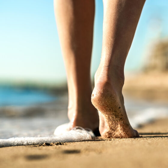 Körperregionen Fersensporn - Füße im Sand